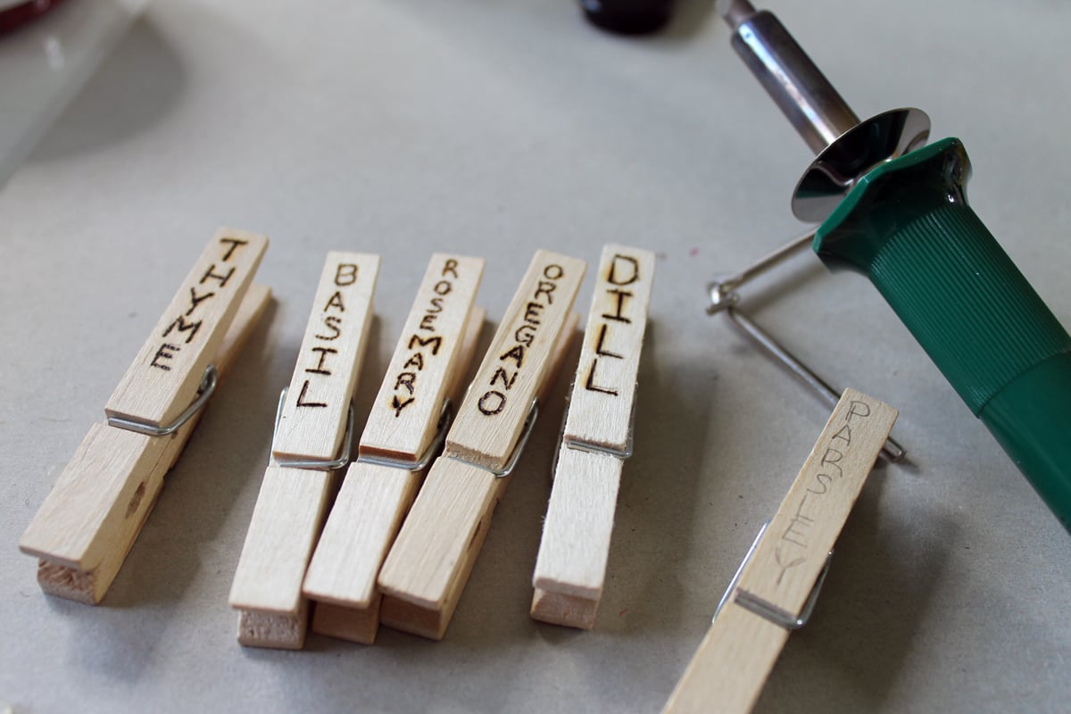 clothespins labeled with wood burning tool